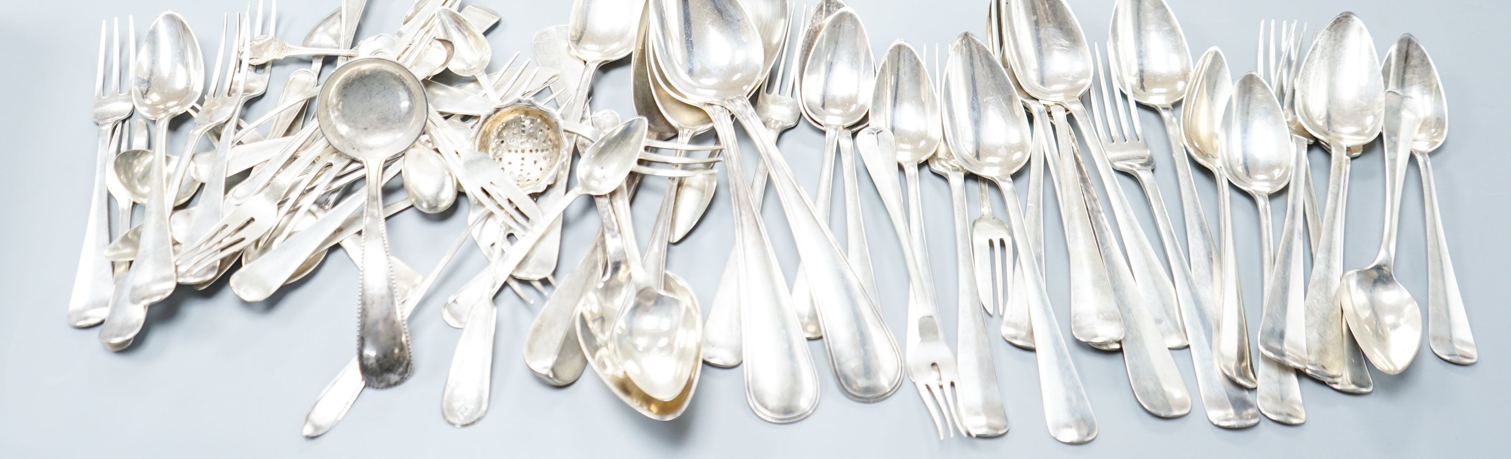 A quantity of assorted mainly Dutch white metal flatware including a part canteen, five English silver cake forks and two plated spoons